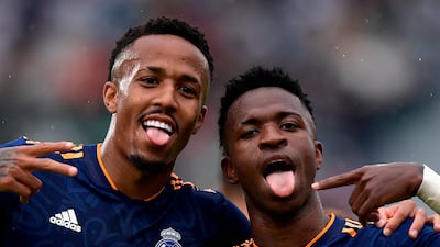Real Madrid's Vinicius Junior celebrates scoring their second goal in the 2-1 win at Elche with Eder Militao. Reuters