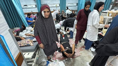 Patients lie on the floor and beds at Kamal Adwan Hospital in Beit Lahia, northern Gaza, after Israeli forces withdrew on October 26. Reuters