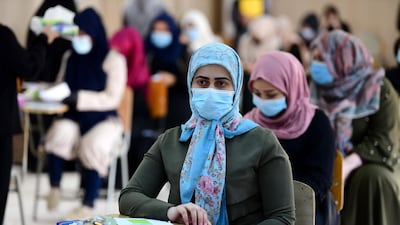 Iraqi high school students during their final exam after five months of school closures due to the coronavirus pandemic, at a school in Baghdad, Iraq. EPA