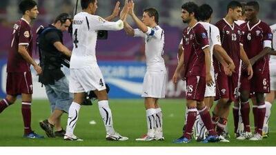 Qatar, in maroon, were comprehensively beaten in their Asian Cup opening game by Uzbekistan, ranked five places higher than the hosts. Karim Jaafar / AFP
