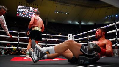 Saul Alvarez retreats to the corner after John Ryder hits the canvas. EPA