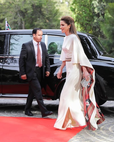 Traditional motifs lines the cape of Queen Rania's kaftan for Jordan's 71st Independence Day. DPA