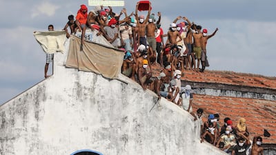 A group of remand prisoners stage a protest on the roof of the Welikada Remand Prison complex in Colombo, Sri Lanka. EPA