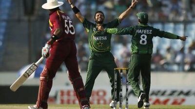 Captain Shahid Afridi, centre, took four wickets as Pakistan bowled West Indies out for just 112 in Mirpur yesterday. Saurabh Das / AP Photo