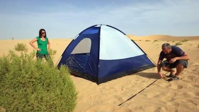 Clare Dight and her husband, Nick Leech, set up camp in the desert between Abu Dhabi and Al Ain in an attempt to have a eco-friendly overnight getaway. Ravindranath K / The National