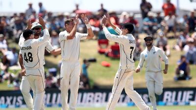 Tim Southee, centre, of New Zealand celebrates the wicket of Ben Stokes. Getty