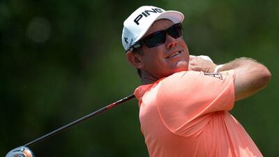 Lee Westwood of England tees off on the seventh hole during the opening day of the Maybank Malaysian Open golf tournament in Kuala Lumpur on April 17, 2014. AFP PHOTO / MANAN VATSYAYANA