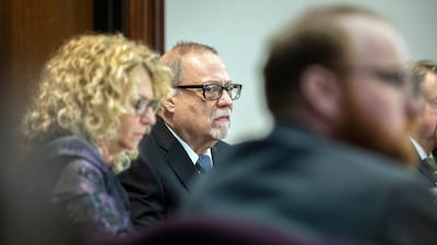 Greg McMichael, one of of three accused in the trial over the killing of Ahmaud Arbery, sits with his lawyer before the start of closing arguments in Brunswick, Georgia. AP