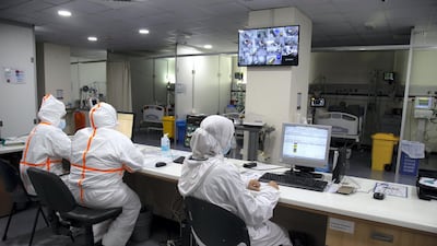 Healthcare staff and nurses watch over Covid-19 patients in the Covid-19 intensive care unit at Rafic Hariri University Hospital in Beirut. Lebanon started a 25-day long nationwide lockdown to battle a surge in coronavirus infections during the holiday season that has challenged the country's already battered health care sector. EPA