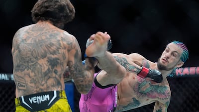 Sean O'Malley tries to kick Marlon Vera during their bantamweight title bout. AP