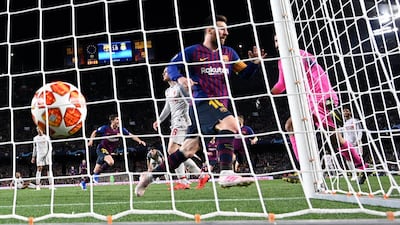 Lionel Messi celebrates after scoring. Lluis Gene / AFP