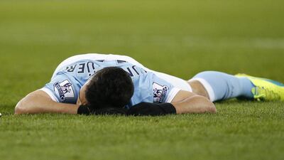 Manchester City’s Sergio Aguero looks dejected after having an appeal for a penalty turned down. Andrew Yates / Reuters