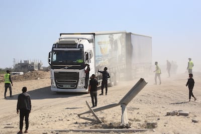 One of a convoy of 10 aid lorries drives towards Deir Al Balah in central Gaza after entering through the Al Karara crossing. AFP
