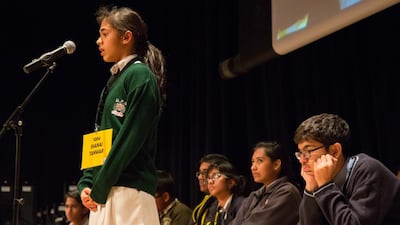 Shanai Tanwar, standing, competes in The Danube spelling Bee competition at the Jumeriah Beach Hotel, Dubai. Duncan Chard for The National