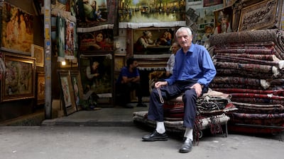 A carpet seller waits for customers in his shop at the Grand Bazaar in Tehran, Iran on August 10, 2026. EPA