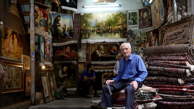 A carpet seller waits for customers in his shop at the Grand Bazaar in Tehran, Iran on August 10, 2026. EPA