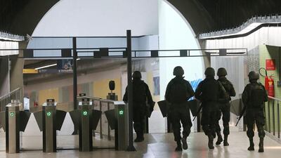 Brazilian soldiers patrol in a station on the new Metro Line 4 ahead of the Rio 2016 Olympic Games that open today. Mario Tama / Getty Images