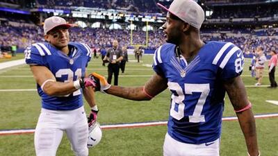 Indianapolis Colts receiver Reggie Wayne is congratulated by Donald Brown