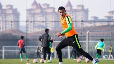 Australian football player Tim Cahill controls the ball during a training session with his new team Hangzhou Greentown in Hangzhou, China's eastern Zhejiang province on February 24, 2016. Cahill signed with Chinese Super League team Hangzhou Greentown on February 22. (AFP)