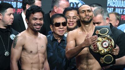 WBA welterweight champion Manny Pacquiao and WBA welterweight super champion Keith Thurman pose during their official weigh-in. AFP