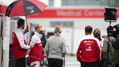 Mick Schumacher of Germany and Alfa Romeo Racing talks to the media after missing his chance to drive in the first practice session. Getty