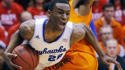 Kansas guard Andrew Wiggins (22) is likely to be in any discussion as a possible top pick in the upcoming NBA draft. Equally discussed may be the notion that teams are tanking their season to have a chance to select him. Orlin Wagner / AP Photo