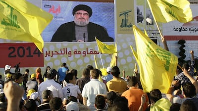 Supporters of Hizbollah listen to their leader, Hassan Nasrallah, as he speaks via a giant screen during the celebration in the southern town of Bint Jbeil, Lebanon. EPA