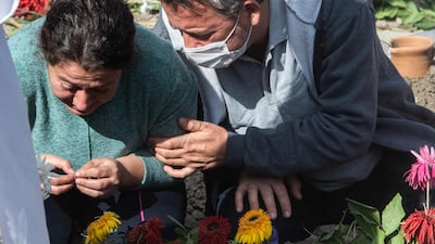 Mourners grieve during a funeral ceremony for two members of the Dogruya family who died when a powerful earthquake struck. Getty Images