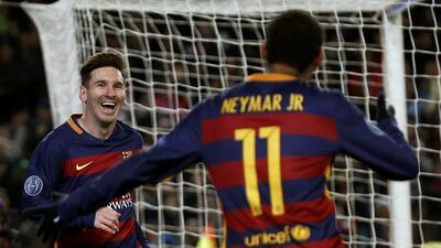 Barcelona’s Lionel Messi celebrates with teammate Neymar after scoring their fifth goal on Tuesday night against AS Roma. Paul Hanna / Reuters