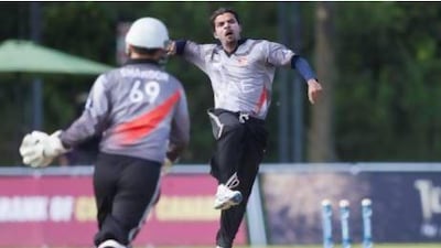 Nasir Aziz celebrates taking a wicket for the UAE during their win over Canada.
