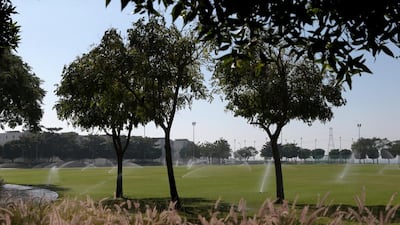The sports field and recreation grounds. The area has football and cricket pitches, as well as a walking path and benches. Christopher Pike / The National