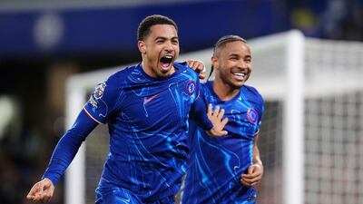 Chelsea's Levi Colwill, left, celebrates scoring their side's third goal of the game with teammate Christopher Nkunku. PA
