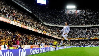 Real Madrid's Gareth Bale celebrates after scoring during the Spanish Copa del Rey final against Barcelona at the Mestalla Stadium in Valencia in April 2014. AFP