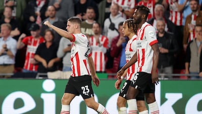 PSV's Joey Veerman celebrates after scoring the first goal. Getty