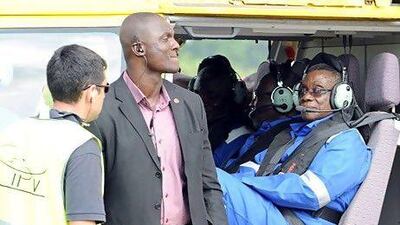 Ghana is the latest country to join Africa's oil bonanza. Ghanaian President John Atta Mills (R) sits prior to fly by helicopter to an oil-processing vessel located at the offshore field, in Takoradi. AFP PHOTO PIUS UTOMI EKPEI