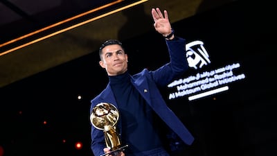 Cristiano Ronaldo holds a career award at the Globe Soccer Awards ceremony in Dubai, Friday, Jan. 19, 2024. AP
