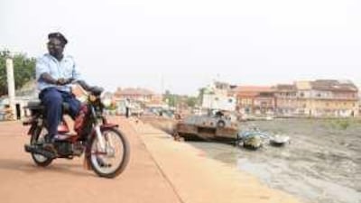 A maritime police officer patrols Bissau's port, which was a hub of drug trafficking.