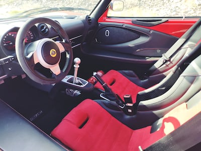 The cabin has just the basics – a small plastic instrument cluster, lengthy aluminium gear lever and pull-up handbrake.