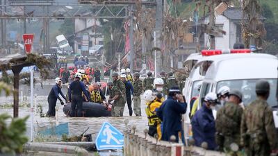 Residents are evacuated from flood-affected area by rubber boats in Kuma village, Kumamoto. AFP
