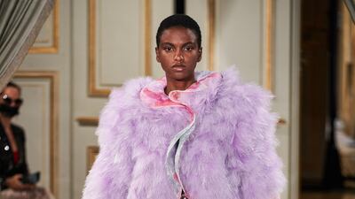 Armani Prive mixed the high sheen of an almost molten fabric with the softness of feathers for haute couture.