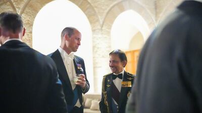Prince William speaks with guests in Amman. PA