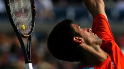 Novak Djokovic of Serbia serves to Arnaud Clement.