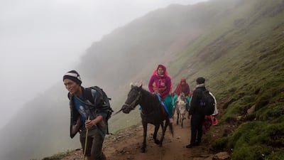 A group of elderly female devotees ride on horses as they travel to Gosaikunda Lake. Narendra Shrestha/EPA