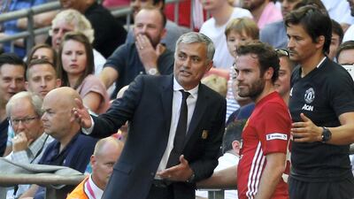 Jose Mourinho gives instructions to Juan Mata during the 2016 Community Shield between Manchester United and Leicester City. AFP