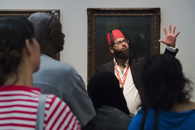 AbdulMalik Tailor leads a tour of the Tate Britain gallery in London, pre-pandemic.