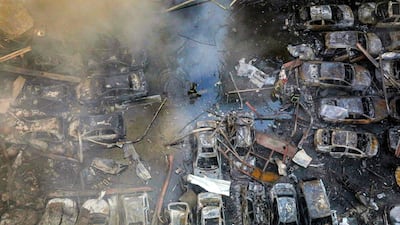 Firefighters attempt to extinguish a fire following an Israeli strike at a neighbourhood of Beirut earlier this year. AFP