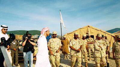 A young Sheikh Abdullah bin Zayed accompanied by a TV crew tours the camp. Also pictured centre right is Obaid Al Ketbi. Courtesy: Maj Gen Obaid Al Ketbi