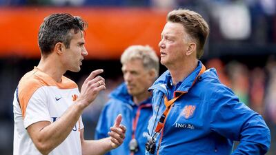 Dutch national team coach Louis van Gaal (R) talks to captain Robin van Persie (L) during a training session of his team in stadium The Kuip in Rotterdam, The Netherlands, 30 May 2014. EPA/KOEN VAN WEEL