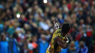Usain Bolt celebrates winning the 4x100-metre relay with Jamaica on Saturday at the Commonwealth Games. Cameron Spencer / Getty Images