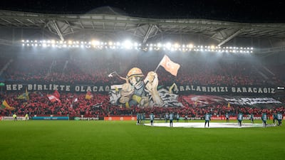 Trabzonspor display a giant tifo and wave Turkey flags to honour of victims of the earthquake in Turkey and Syria. AP